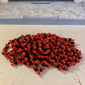 Pile of Red & Black Plastic Stretch Bracelets Louisville/Cal State/Grinnell